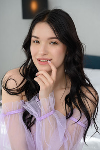 Wikki K Entices As She Spreads Her Long Legs Invitingly On The Bed