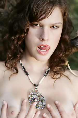 Beautiful model posing nude outdoors