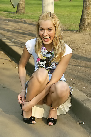 Cool, fun blonde flashing her pussy in public