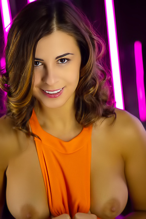 Alice Kelly Voluptuous Beauty Tugs At Her Vibrant Orange Bodysuit