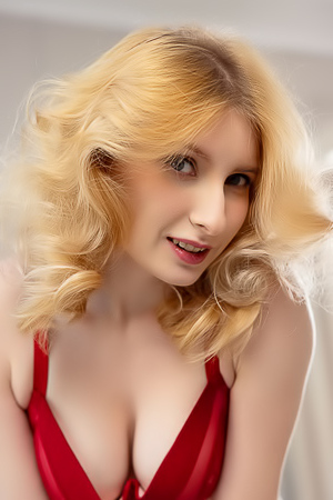 Minnie Lighter Teases On The Couch With Seductive Lingerie And Alluring Curves