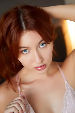 Noi Feja poses in lace nightie invitingly spreading legs