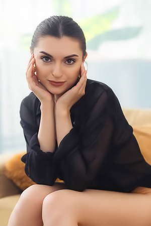 Julia K. Reveals Intense Desire on Couch Dominating with Black Lingerie